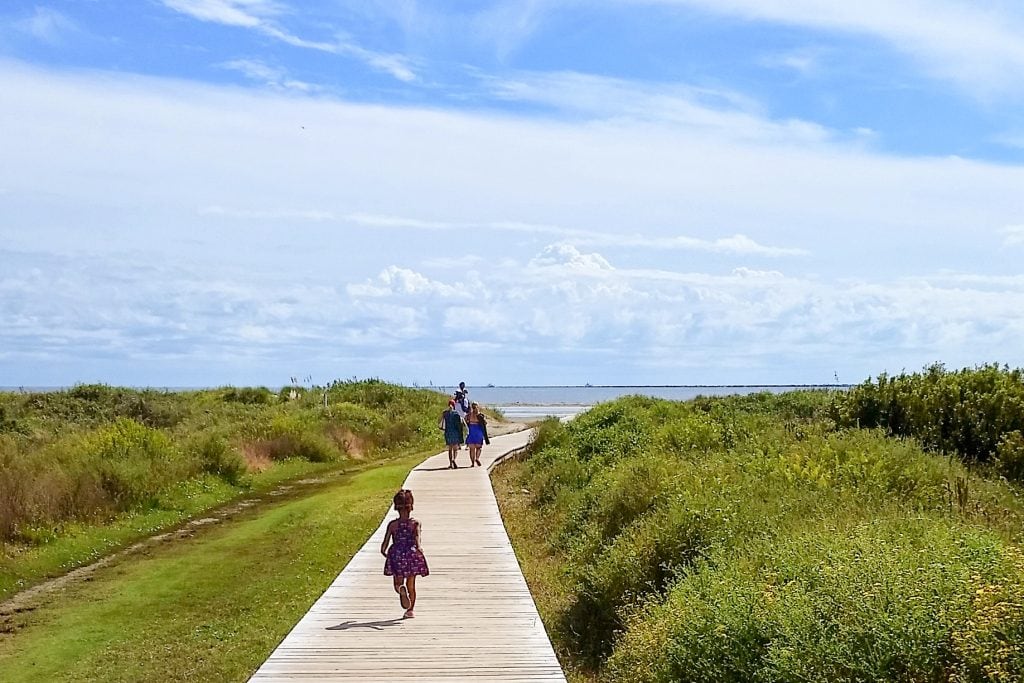 kid running boardwalk