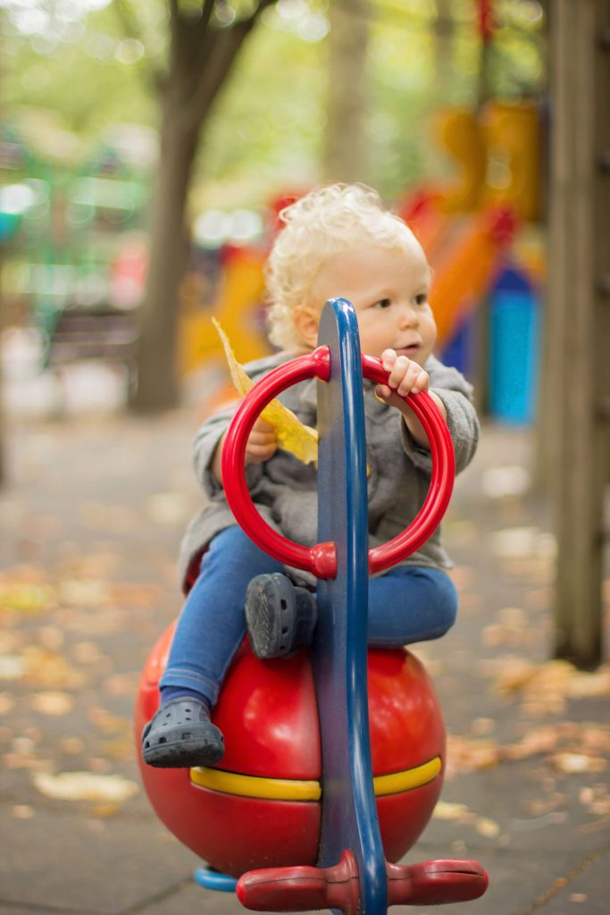 Child plays on playground in Paris