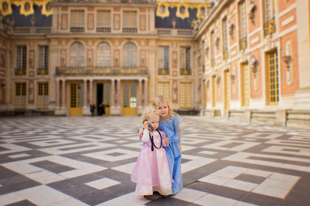 Two kids explore Versailles palace