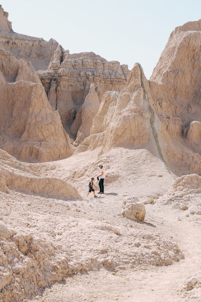 Father and son hiking in Badlands National Park