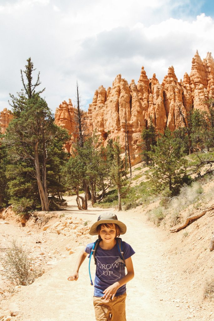 Boy running through Bryce Canyon National Park