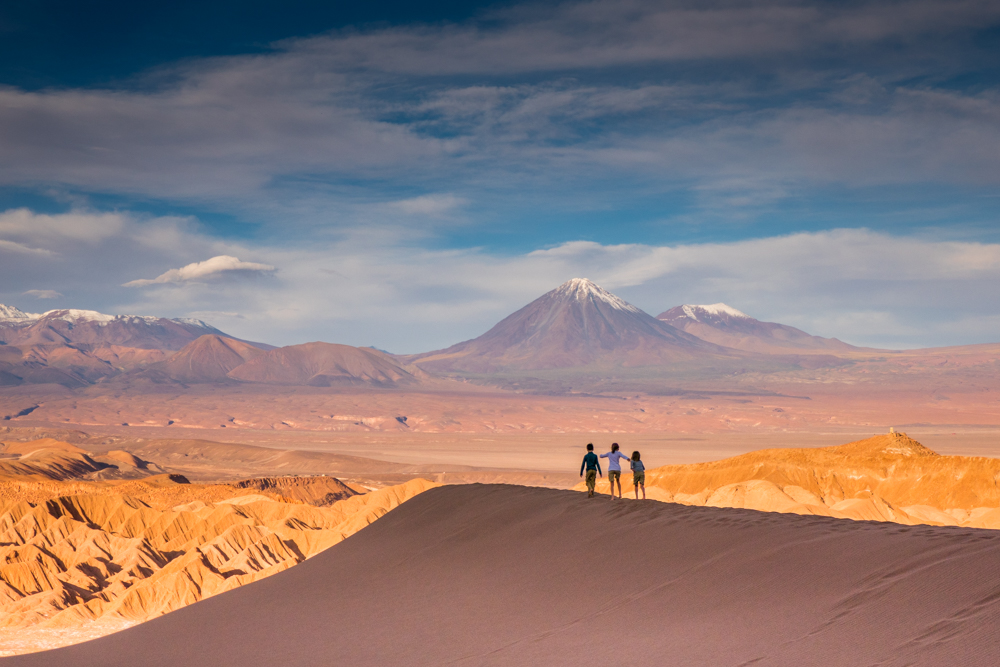 Family hiking through desert