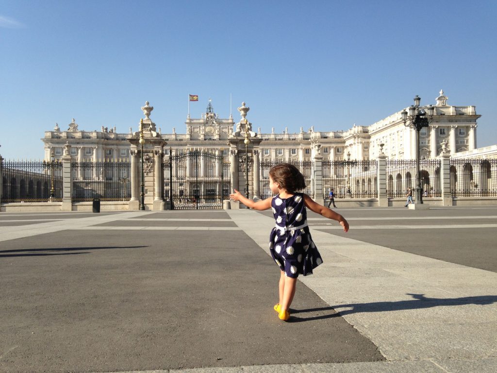 Girl in front of Royal Palace in Madrid