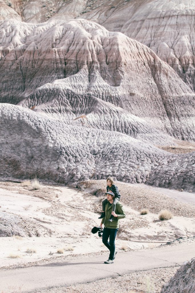 Father and son hiking through Petrified Forest National Park