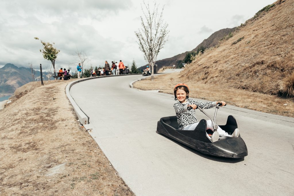 Girl on Skyline Luge in Queenstown, New Zealand