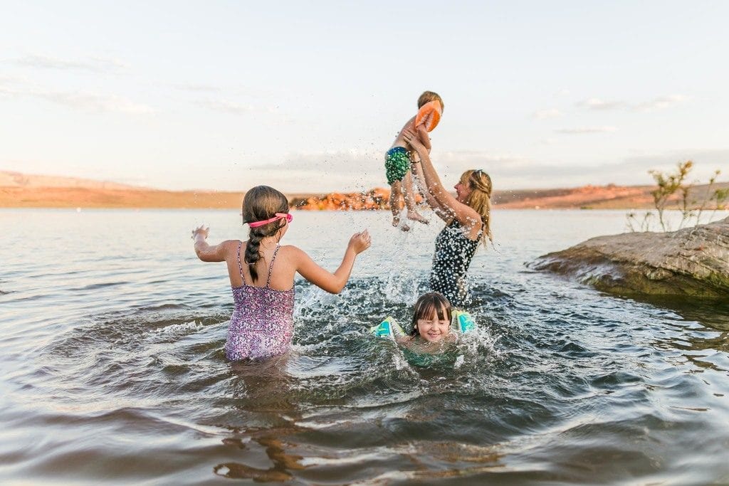 Family playing in lake
