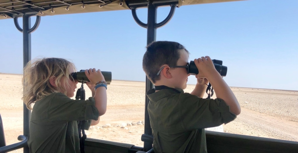 African Safari Holidays: Boys looking for wildlife in Entosha