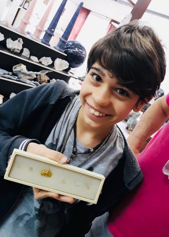 Brazil for Kids: A collection of rough diamonds and a gold nugget