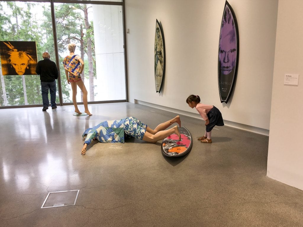 Things to do in Stockholm with kids: girl at Artipelag looking at Warhol exhibit