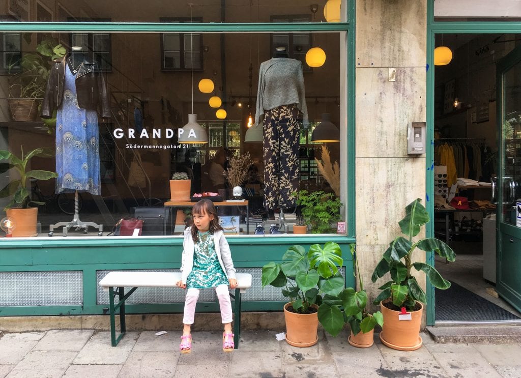 Things to do in Stockholm with kids: girl on bench in Södermalm