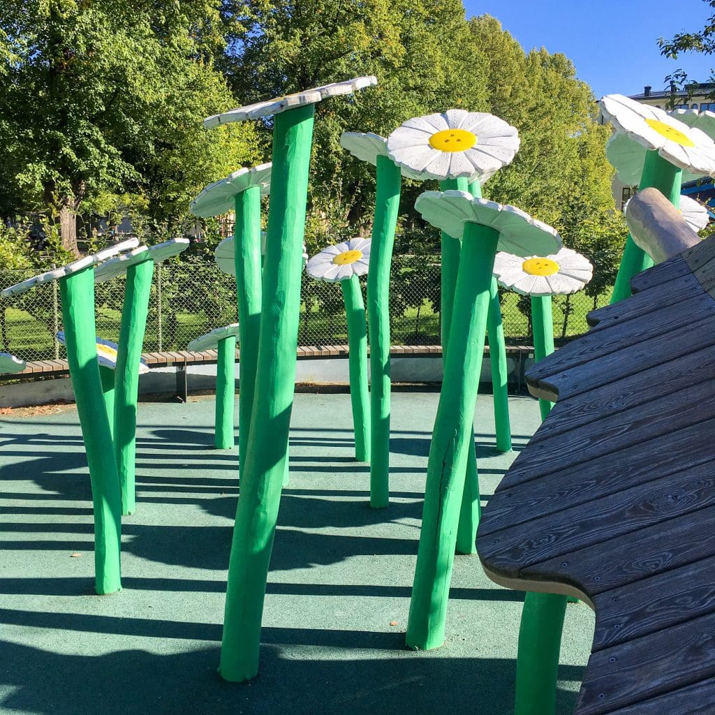 Things to do in Stockholm with kids: wooden flowers at Uggleparken playground