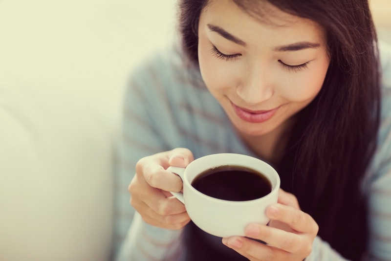 Woman-relaxing-on-couch-with-coffee.jpg