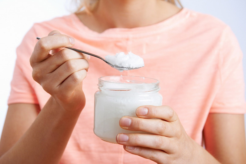 Woman-with-spoonful-of-coconut-oil.jpg