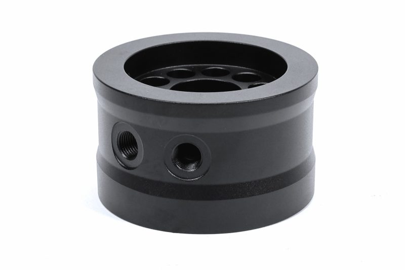 A black PERRIN Oil Temperature Adapter.