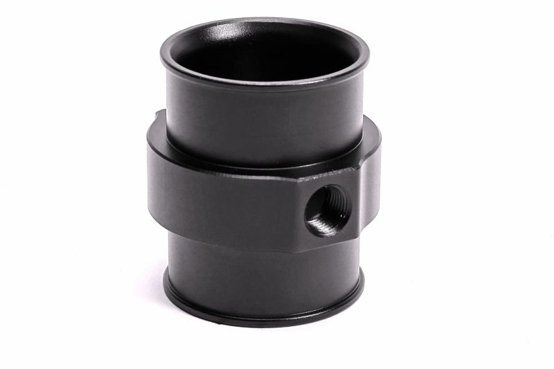 A black PERRIN Coolant Hose Adapter.