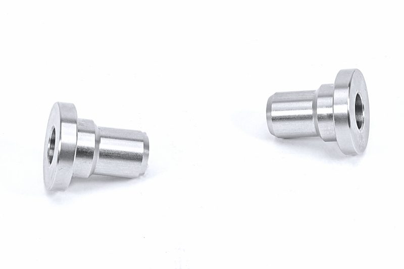 Two PERRIN Subframe Lockdown bushings on a white background.
