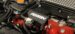 Perrin part shown attached to car engine