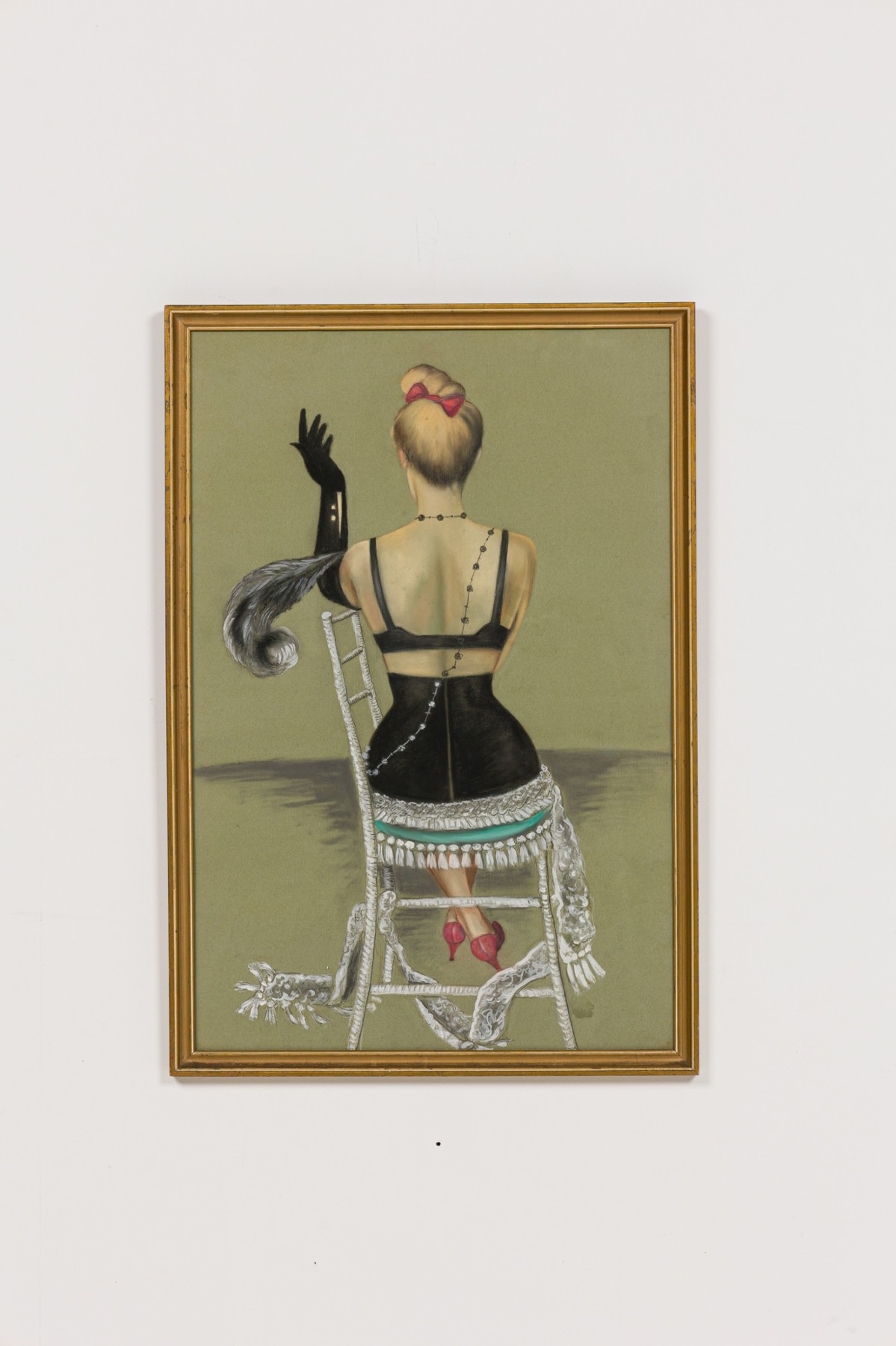 Lady in black sitting in a wicker chair