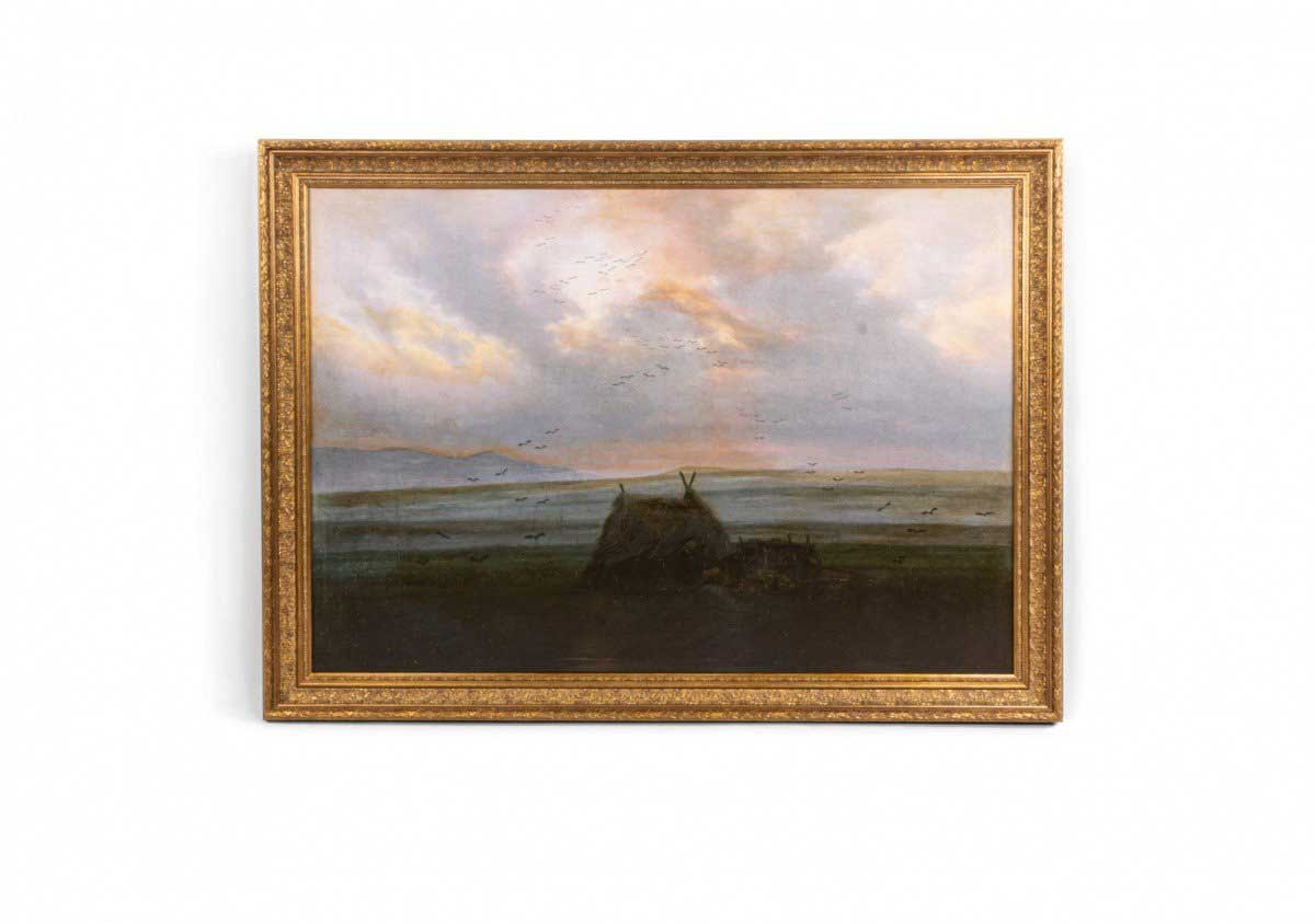 Painting of a mountain cabin in a gilt wood frame