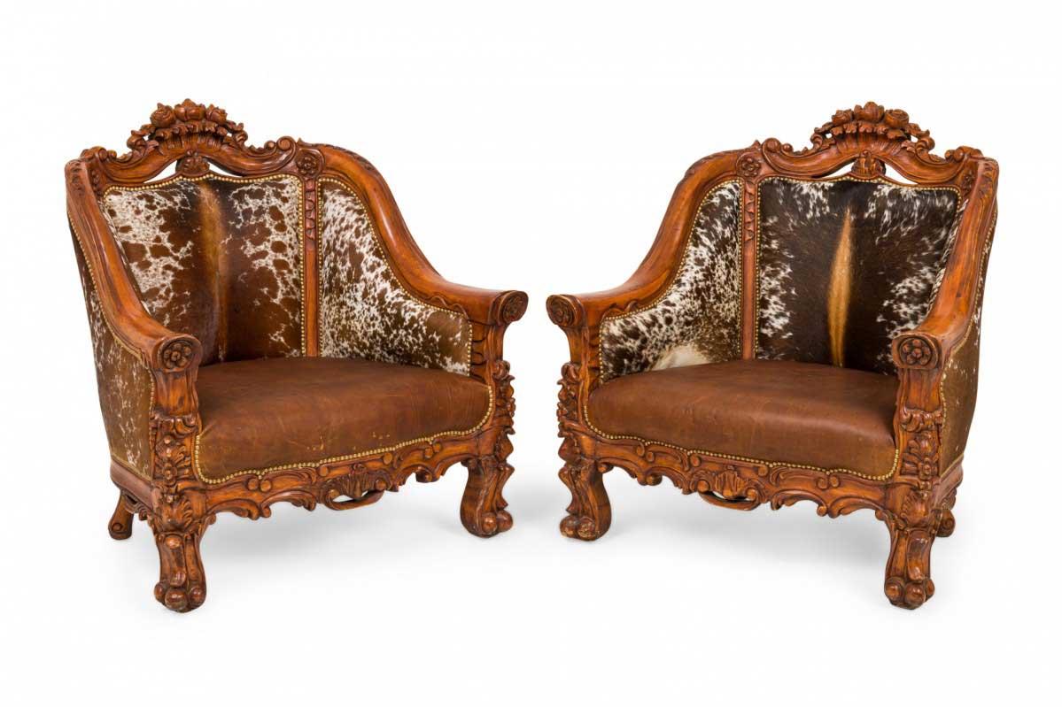 Pair of Contemporary American Carved Walnut and Cowhide Wide Lounge Armchairs