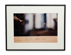 Color photograph detail of a photograph with script