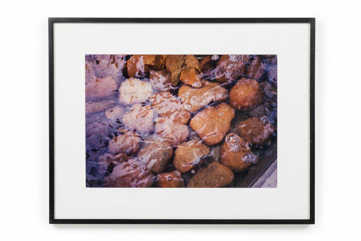 Color photograph of a stream with rocks
