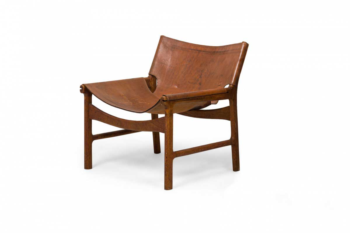 Illum Wikkelso Danish Mid Century Caramel Leather and Oak Sling Design Lounge Chairs