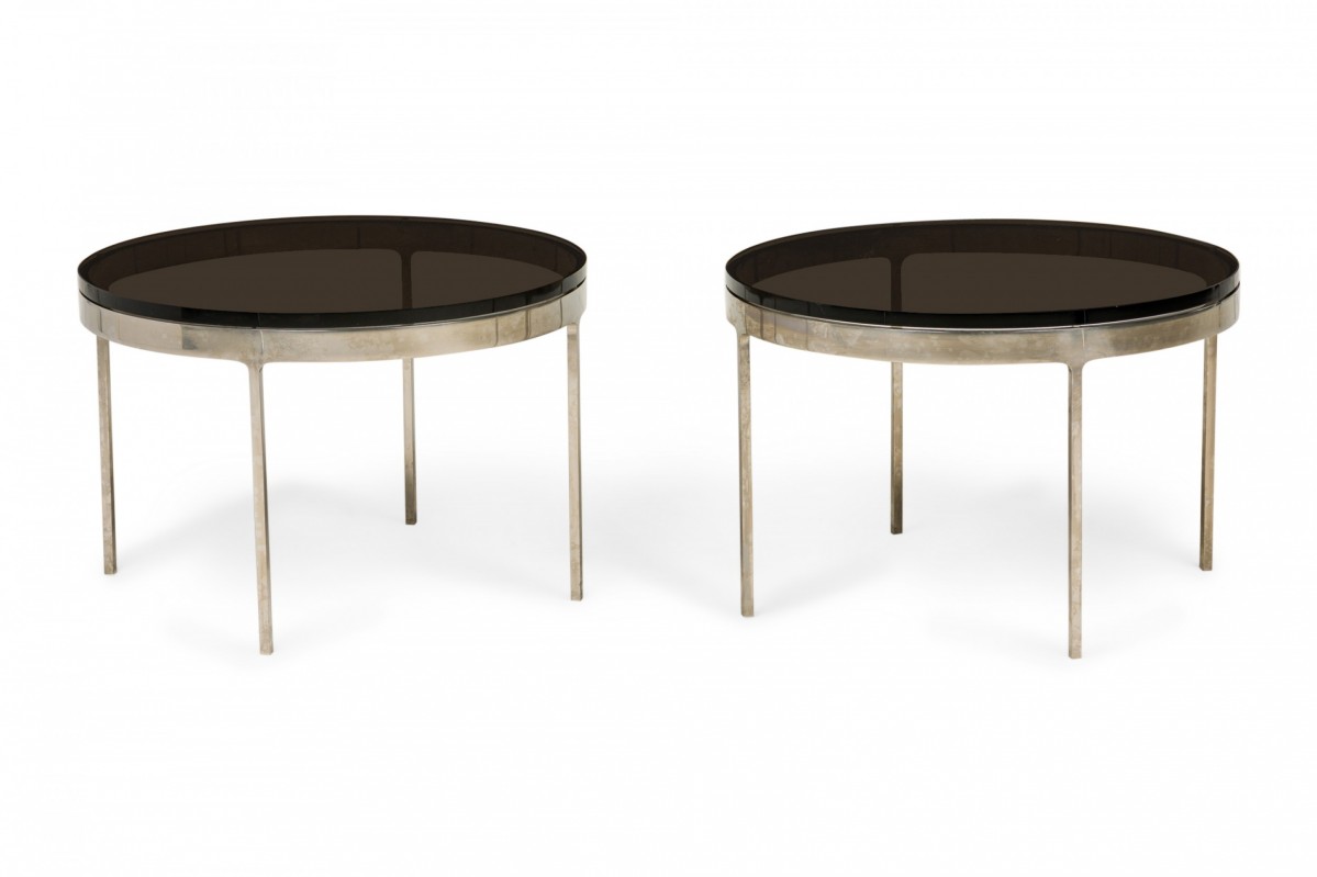 Pair of nicos zographos mid century circular smoked glass and stainless steel end side tables