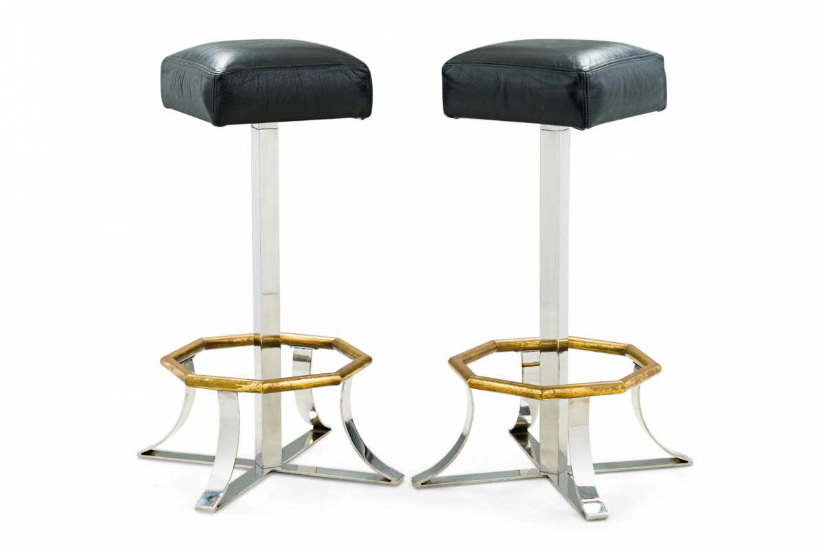 Pair of mid century american polished chrome brass and black leather barstools