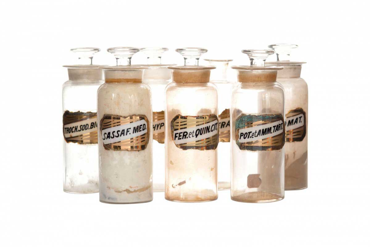 Set of 7 antique glass apothecary bottles 1