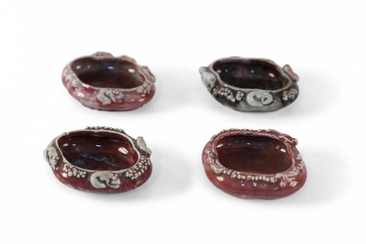 Set of Four Chinese Red Porcelain Catchalls
