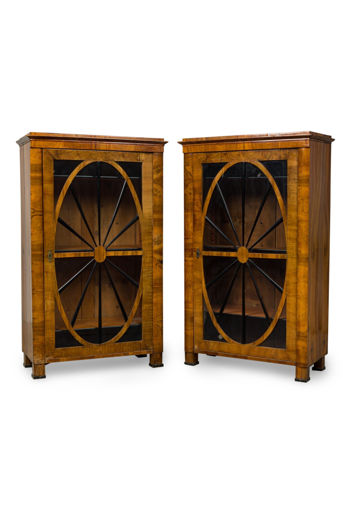 Pair of biedermeier walnut and ebonized wood glass door book cabinets
