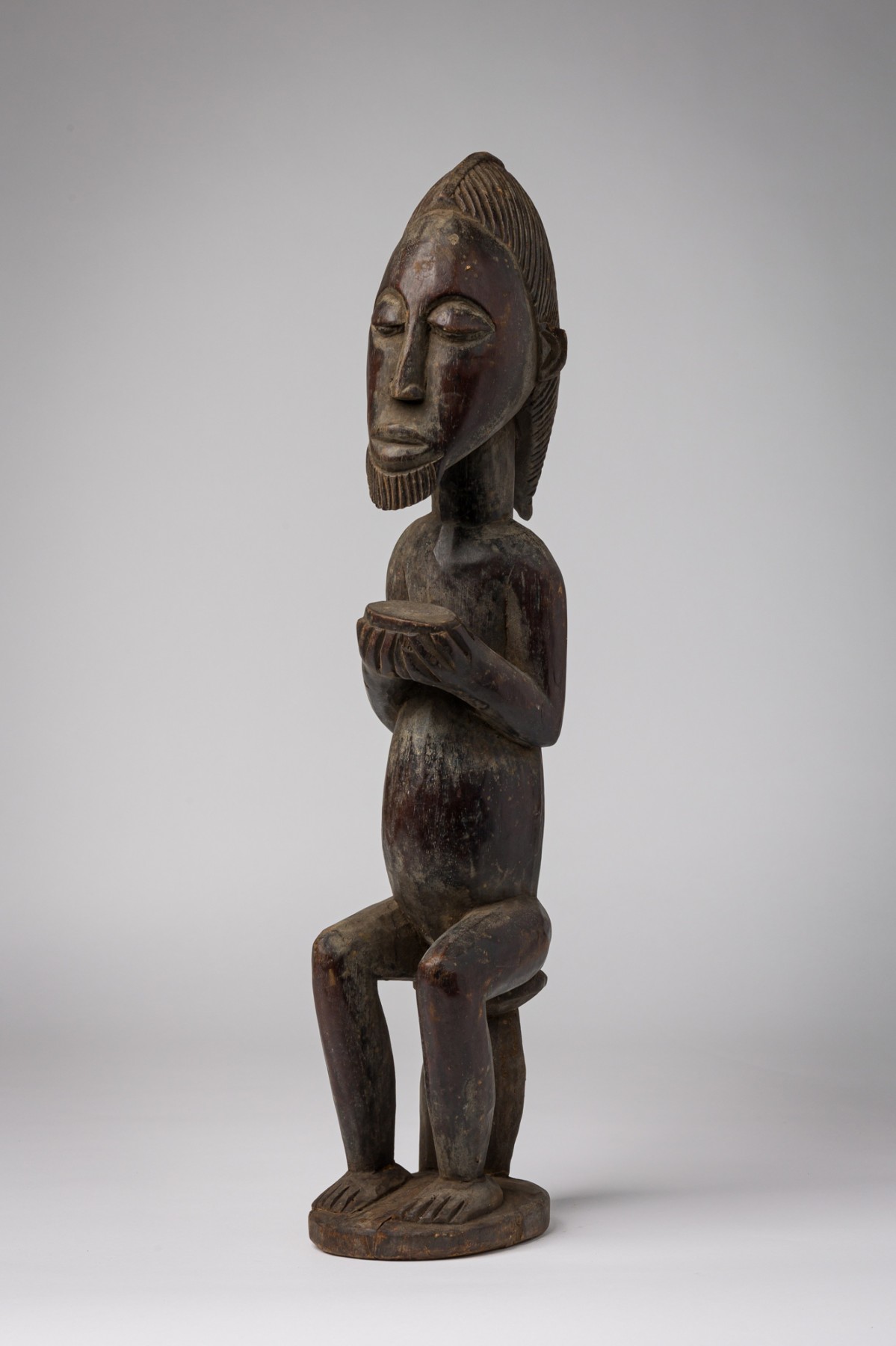 African ivory coast wooden figure with bowl