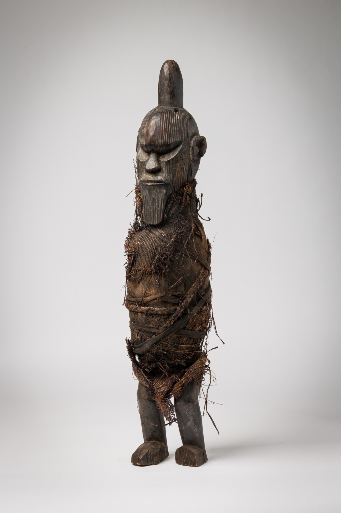 African congo early 20th century male figure wrapped in raffia burlap 