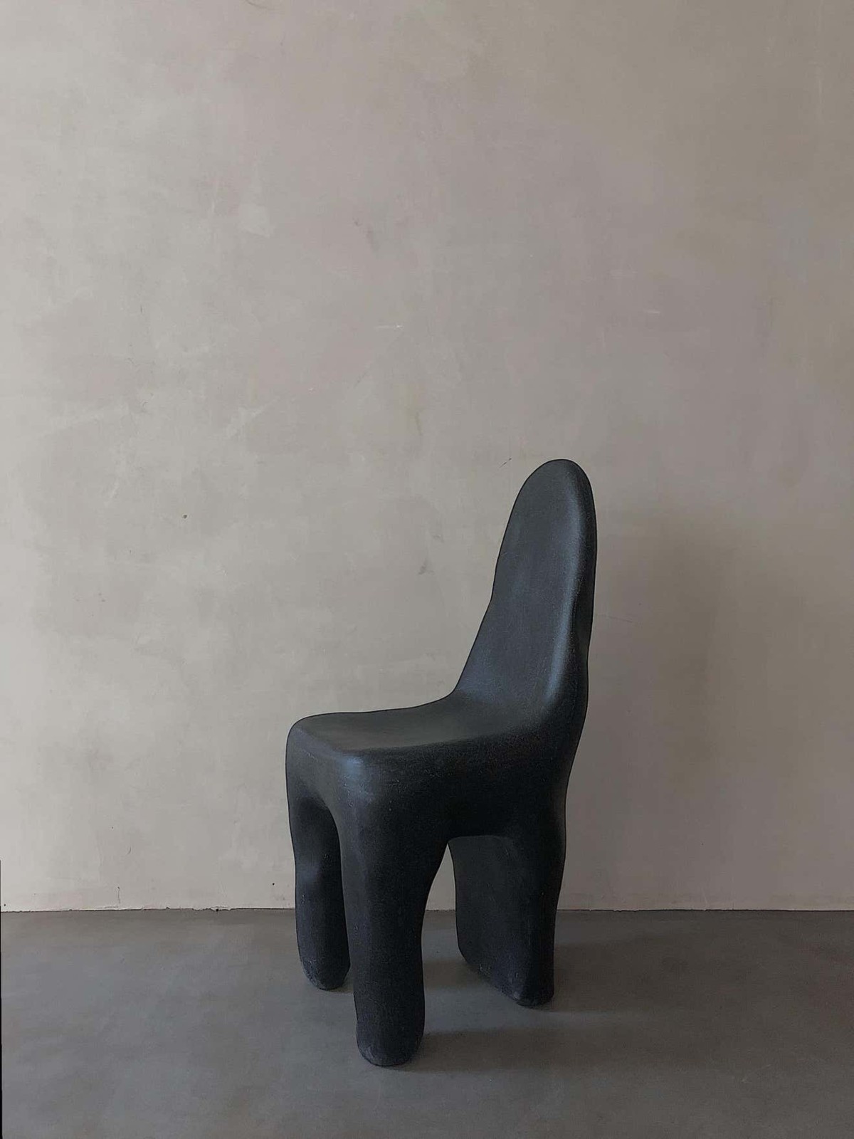Contemporary black amorphous playdough fiberglass side chair