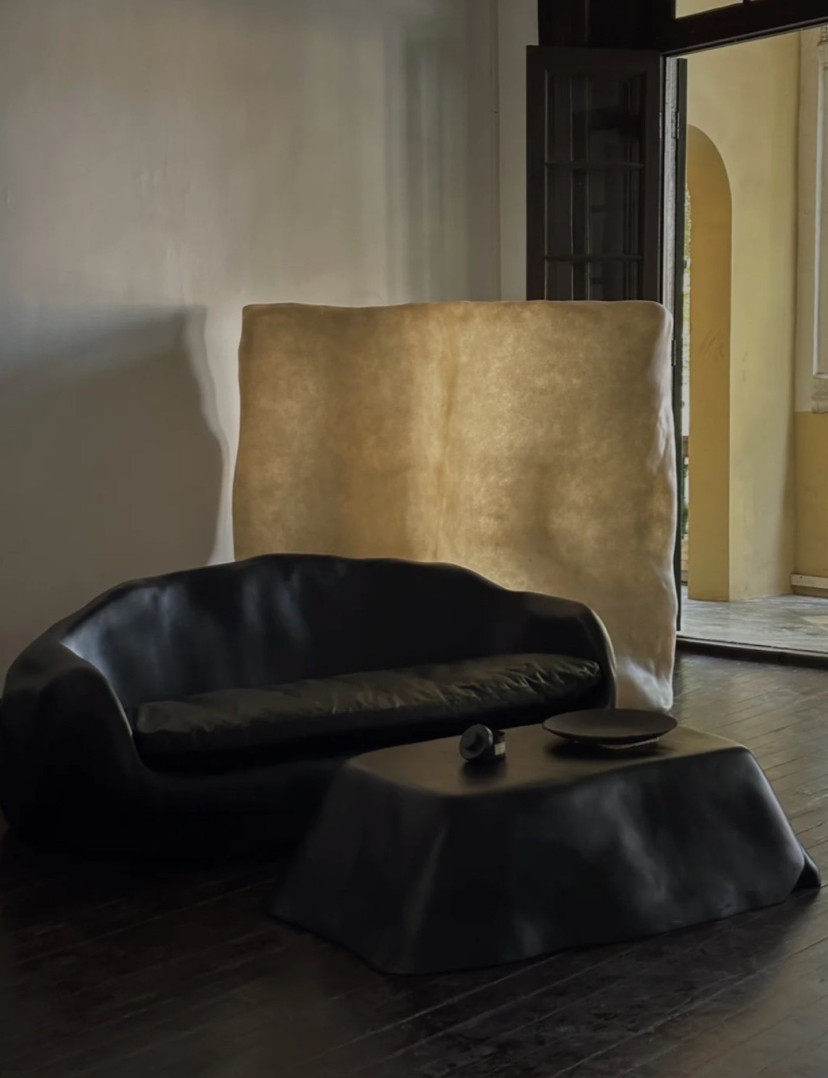 Contemporary black amorphous pudding fiberglass coffee table