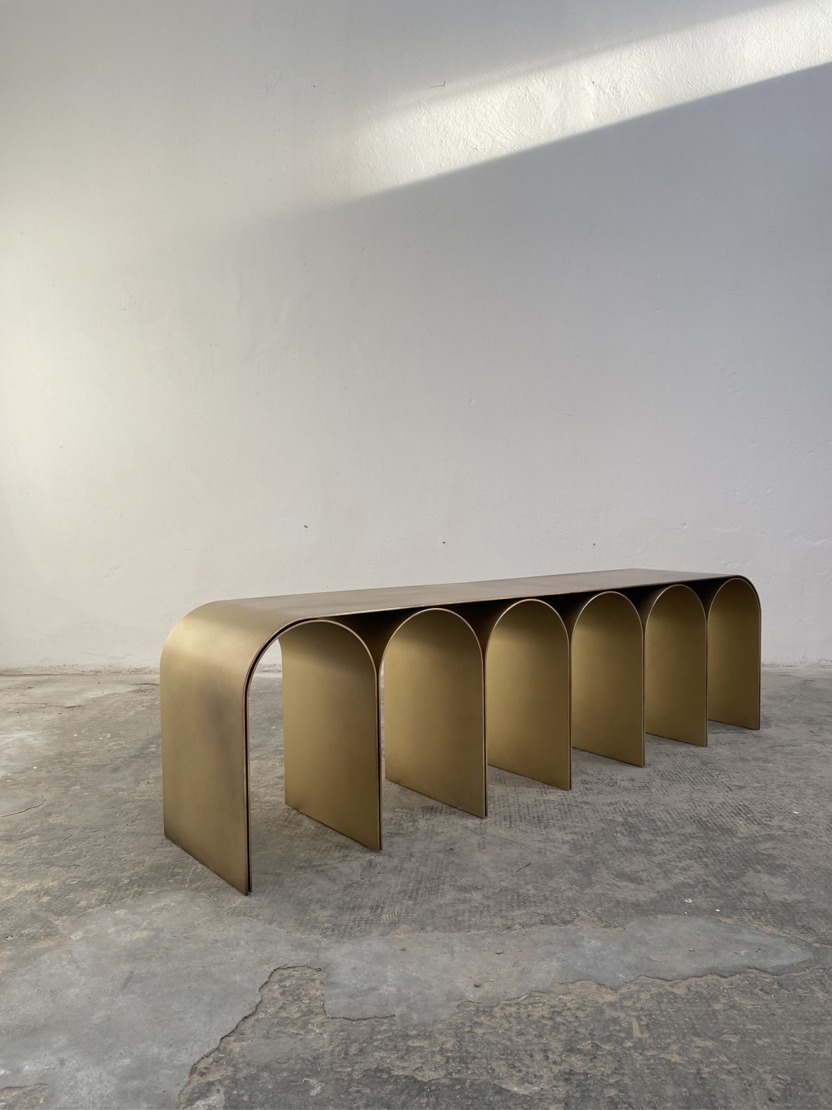 Contemporary steel gold arch bench