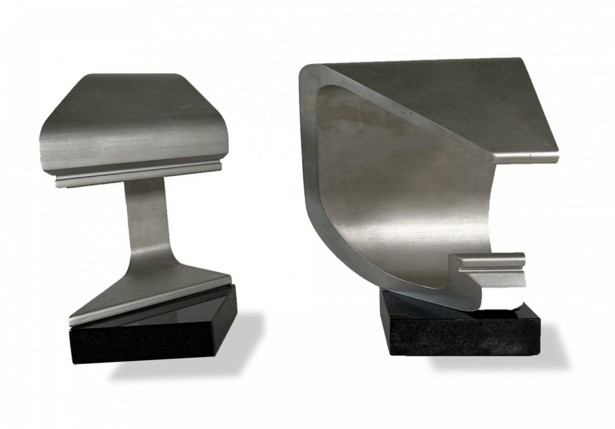 Pair of metal abstract sculptures on marble bases