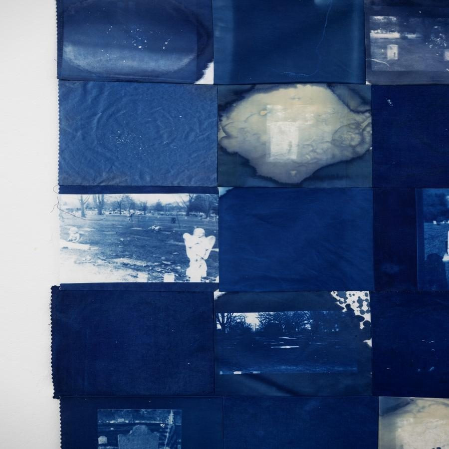 A grid of cyanotype prints with abstract patterns and photographic imagery, predominantly in blue and white tones.