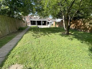 Level backyard with parking area
