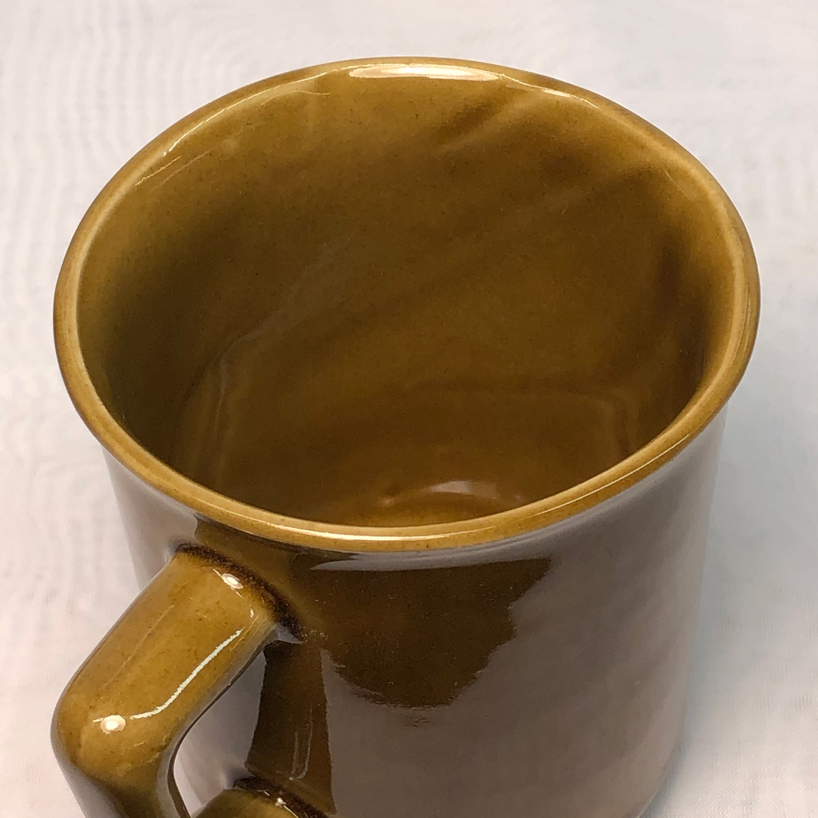 The inside view of a fired mug showing uneven wall thickness