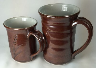 Two mugs with iron crystal glazes