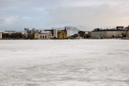 Looking across the frozen Tjrnin (lake)