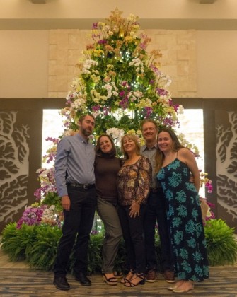 In front of the orchid tree