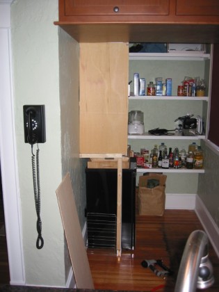 Building the divider between the shelves and fridge