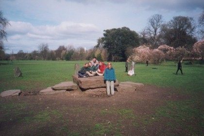 Spike, Barlo, Mark, Ryan, and Chryssi on a rock with Eurotrash playing &quot;baseball&quot; in the background