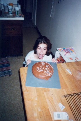 Liz examines the birthday cake