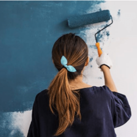woman painting wall