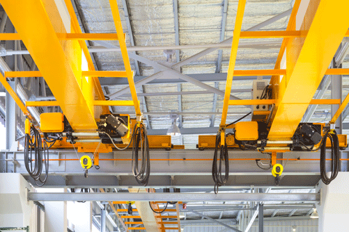 A hoist and crane system in a warehouse.