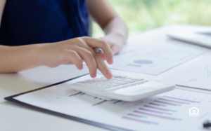 Woman calculating real estate investments.